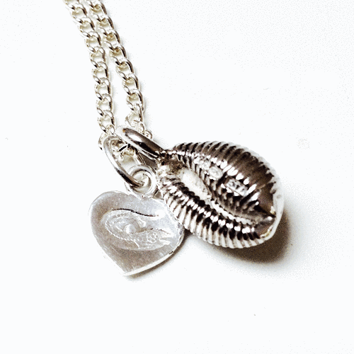 Silver cowrie shell on sale necklace