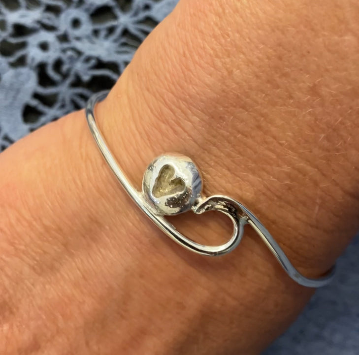 Silver wave bangle with pebble and sand inlay