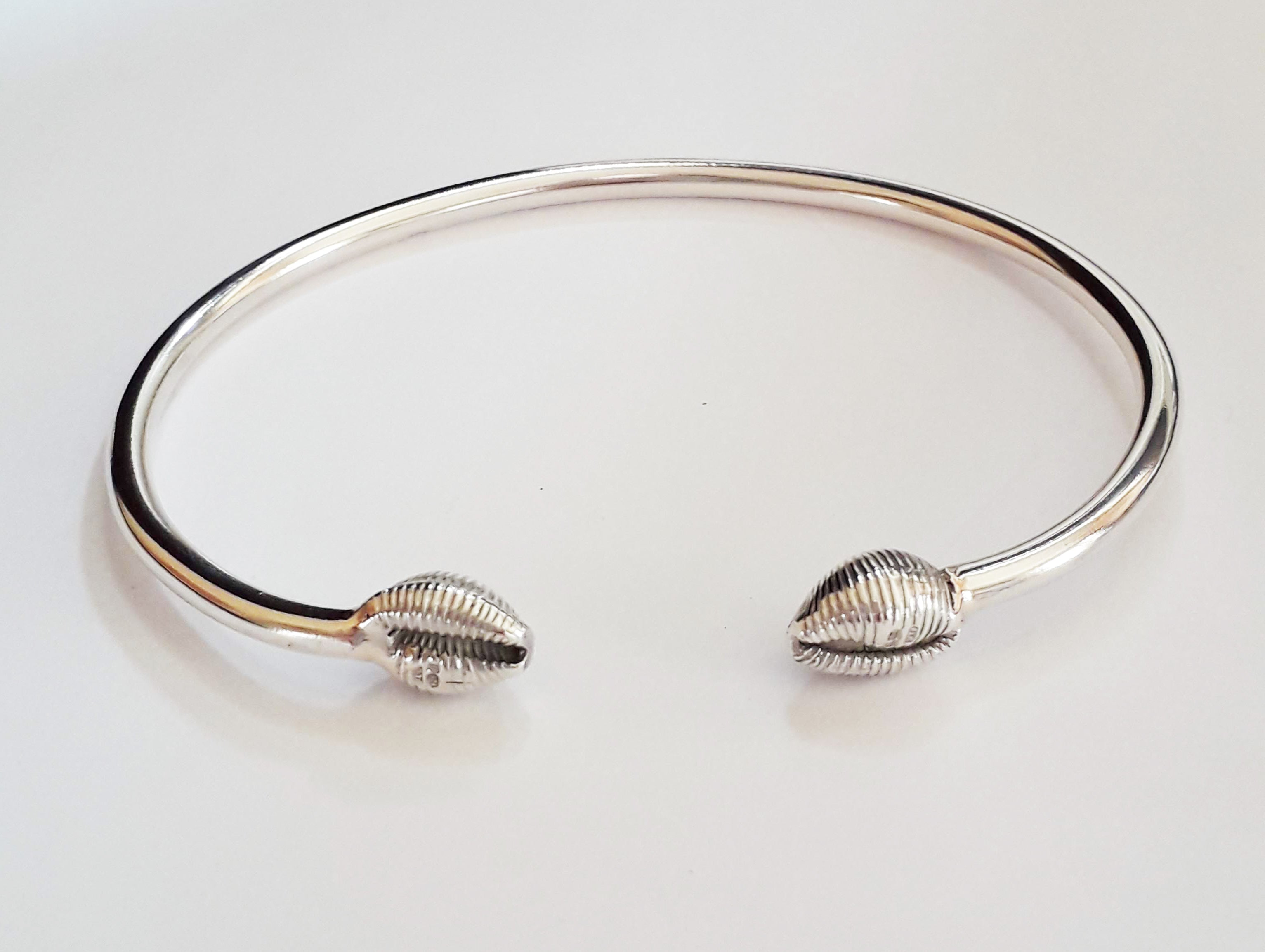 Silver cowrie deals shell bracelet